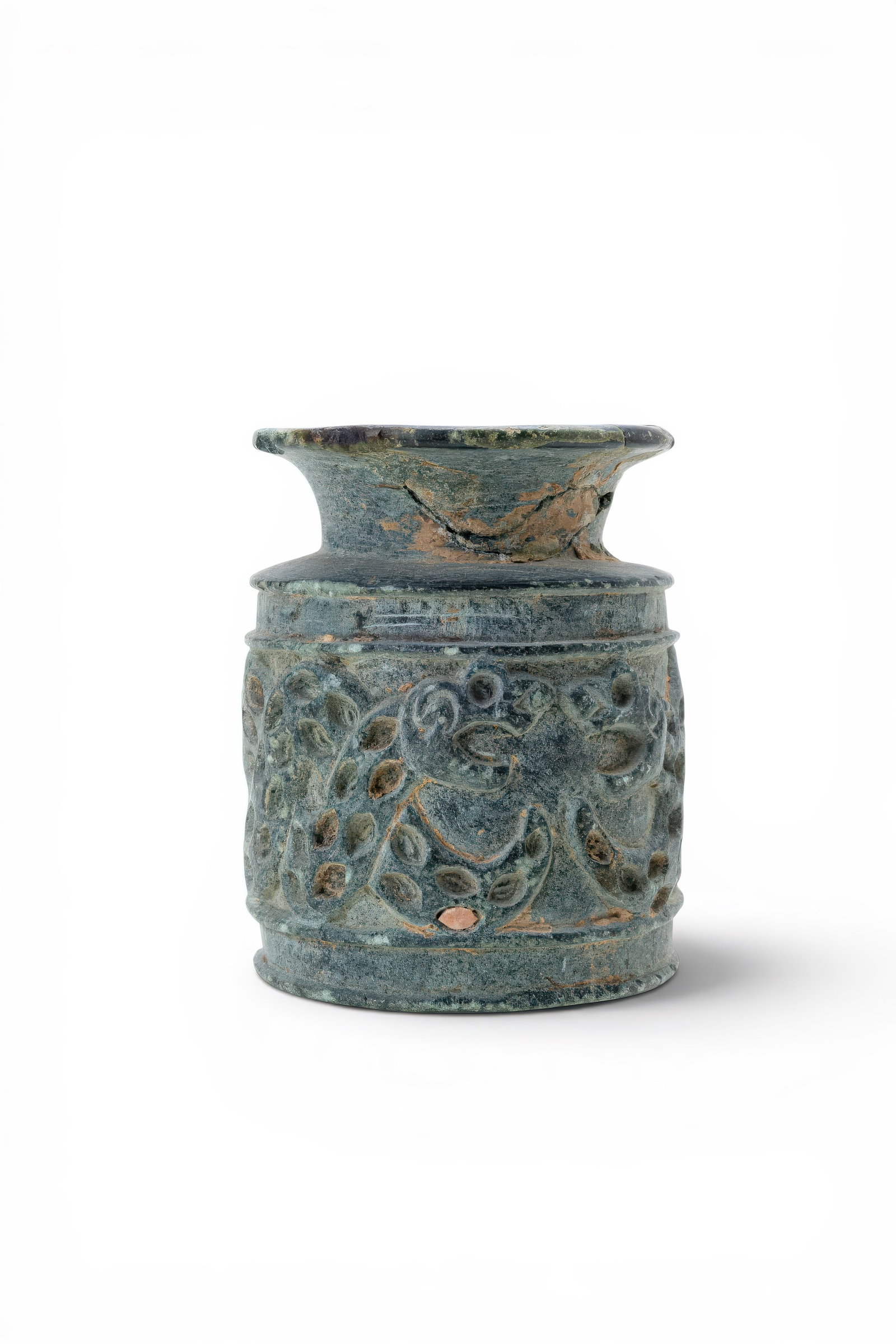 BACTRIAN CHLORITE JAR INLAID WITH SNAKE MOTIFS: Ca. 3000 - 2500 BC. A chlorite jar with a cylindrical body, a short funnel-shaped neck, and a broad everted rim. The body is carved in relief with entwined serpents, each with recessed circular and ov