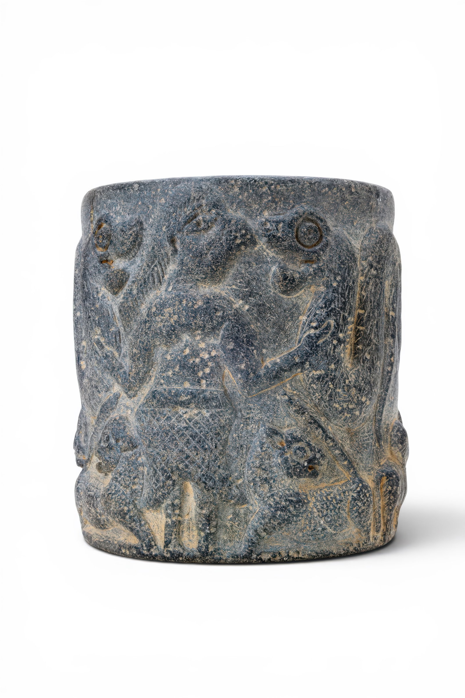 MESOPOTAMIAN STONE PYXIS WITH MASTER OF ANIMALS: Ca. 2600 - 2400 BC. A stone pyxis with a tall cylindrical body, thick rounded rim, deep interior, and flat circular base. The exterior is carved in low relief with a master of animals scene, centred o