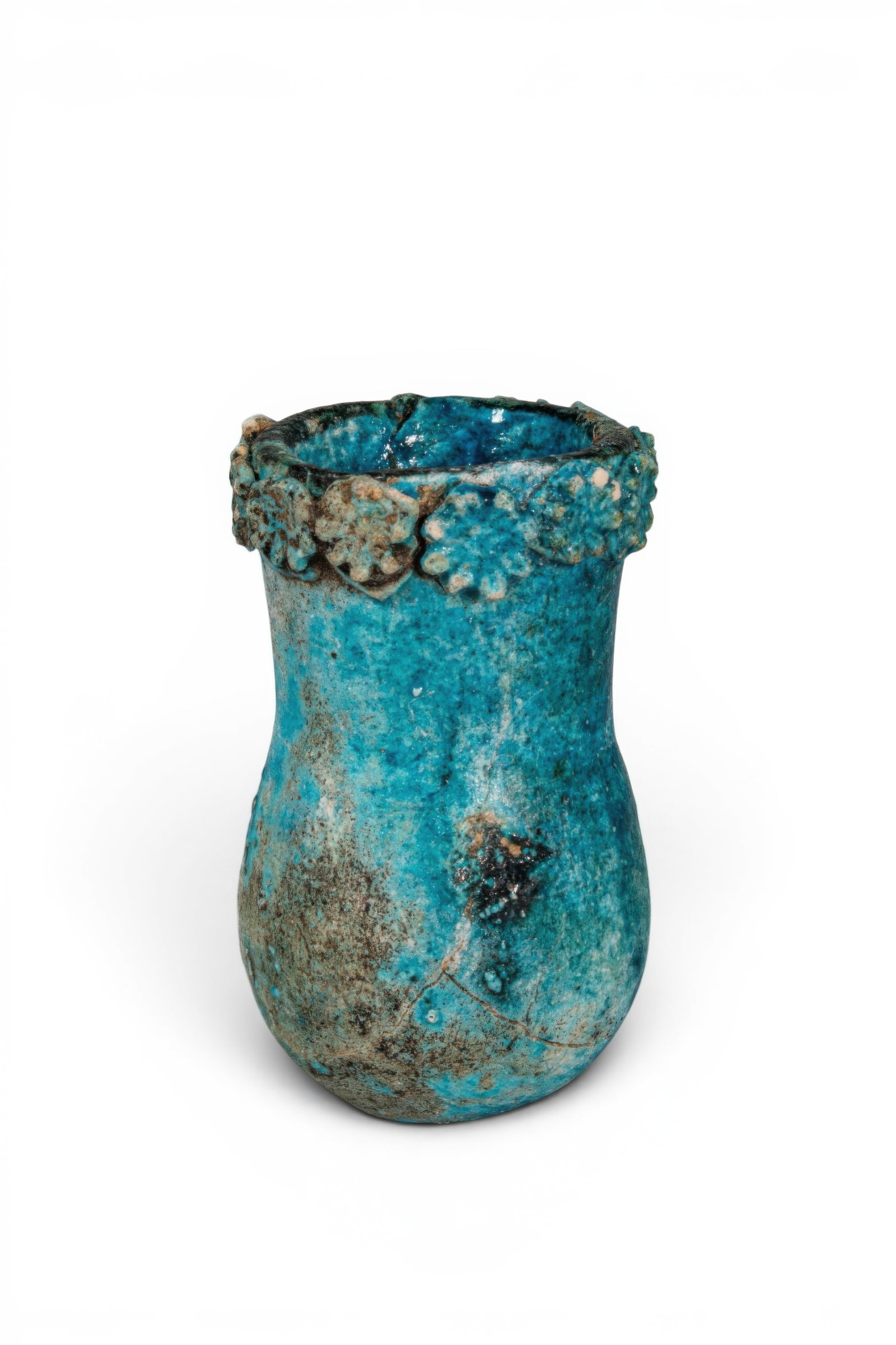 ROMANO-EGYPTIAN FAIENCE JAR WITH ROSETTES: Ca. 30 BC - AD 200. A blue faience jar with a rounded lower body and a tall, slightly flaring neck. The mouth is encircled by a collar of applied rosettes. For similar see: The British Museum, Miscell