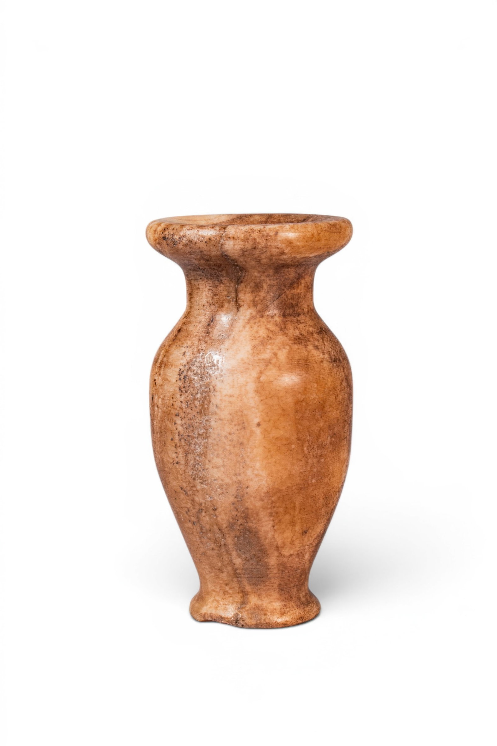 EGYPTIAN ALABASTER JAR: Old Kingdom, Ca. 2640 - 2200 BC. An alabaster jar with an ovoid body tapering to a narrow foot. A short tubular neck supports a broad everted mouth with a thick rounded rim. Size: 145mm x 75mm; Weight