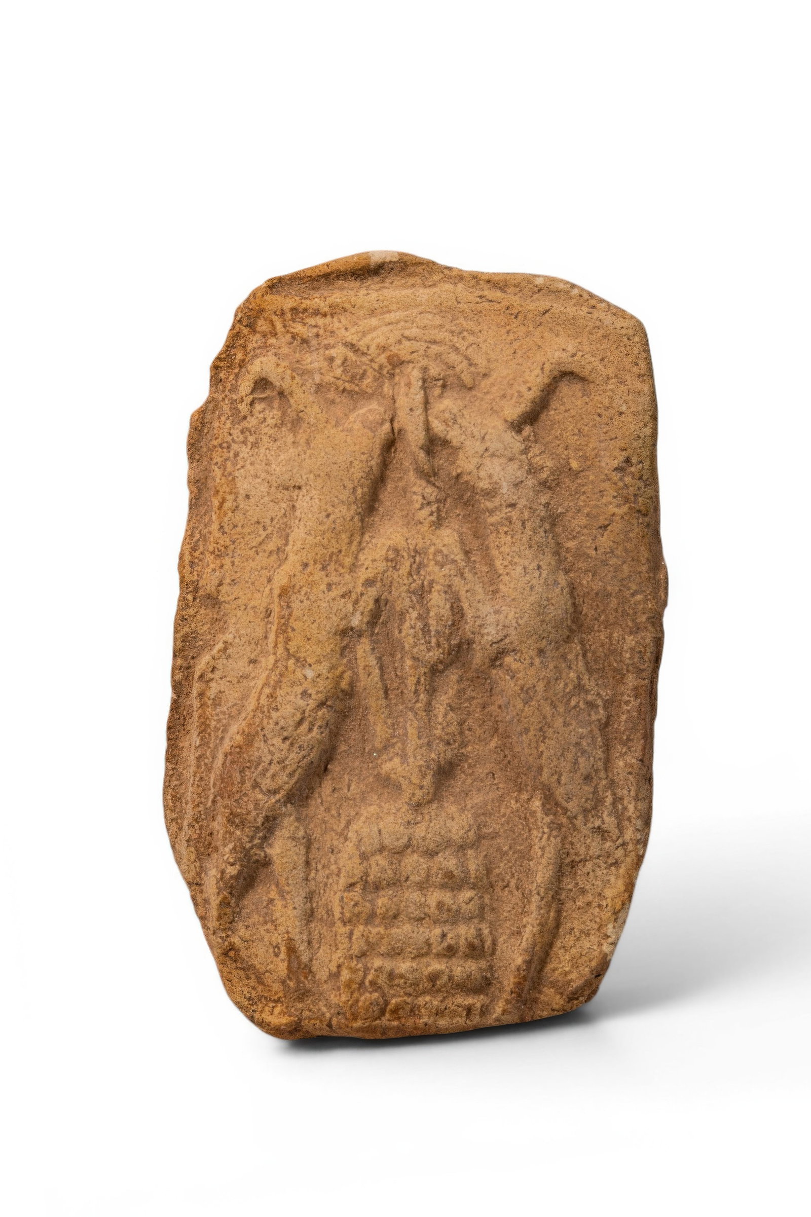 BABYLONIAN TERRACOTTA PLAQUE WITH TREE OF LIFE FLANKED BY RAMPANT IBEXES: Ca. 2000 - 1600 BC. A terracotta plaque moulded in relief with a stylised tree of life rising from a stepped base, flanked by two rampant ibexes turned inward with raised forelegs and elongated necks.