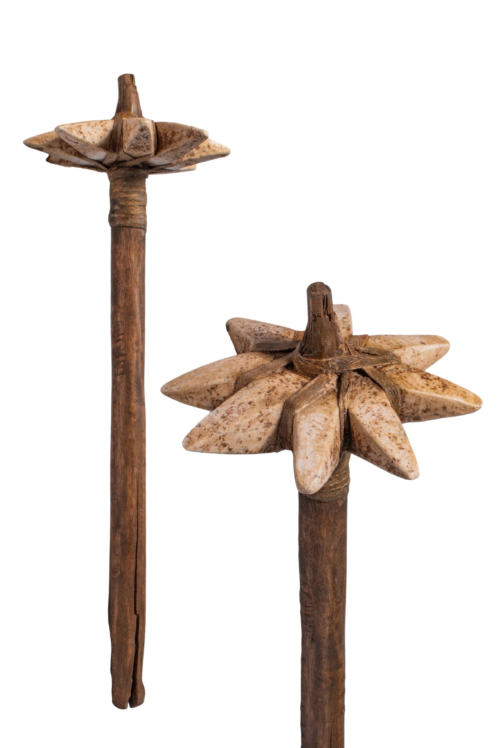 MESOPOTAMIAN STONE AND WOOD STAR-SHAPED MACE: Ca. 1200 - 800 BC. A stone and wood mace with a long tapering shaft and a star-shaped head carved with eight radiating pointed lobes. The head is pierced through the centre for the shaft and bound in 
