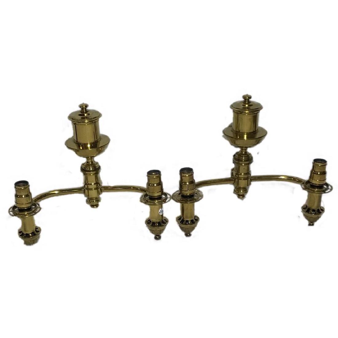 Pair of Antique Brass Sconces: Pair of antique solid brass two arm electrified sconces, unusal pieces. Missing one switch to turn on light. Measures 13 1/2" x 10 1/2".