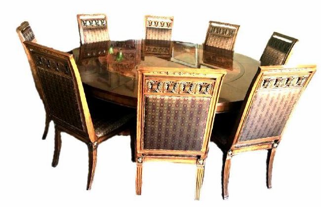 Henredon Round Dining Table and Chairs: Amazing round dinning table for 8. This piece was made by Henredon With an original purchase price over $16,000. It measures approximately 31" high, and 60" across. Their are leaves included that incr