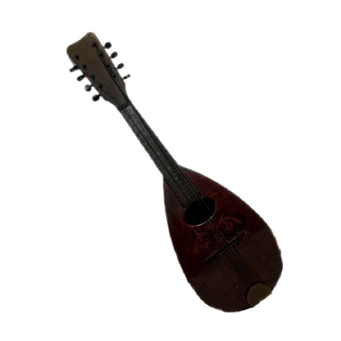 Antique Ukulele: Vintage hand made looking Ukulele with various types of wood. Unusual pineapple shape on back with lighter colored wood. , 6 strings. Inside reads made in U.S.A. Measures about 24" length x 7.5"