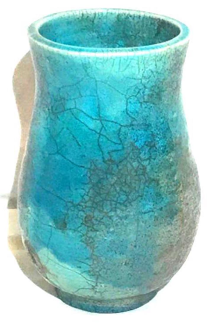 Hand Thrown Blue Green Speckled Vase: This hand thrown pottery vase has somewhat chameleon glaze. It seems to change color a bit in different lighting. It measures approximately 6.75" wide by 6.75" tall.