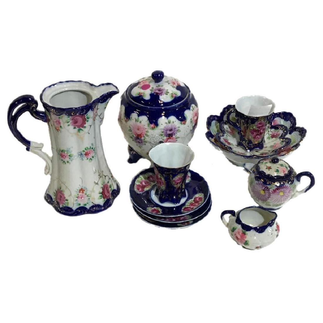 11 Pc Lot of Vintage Hand Painted Porcelain: Lot includes:1 pink rose and royal blue bowl marked Hand Painted Nippon 7.5"2 cups3 saucers1 ginger jar with lid (lid has a crack) 7" tall1 chocolate pot with a marking 8" tall1 small teapot (lid ha