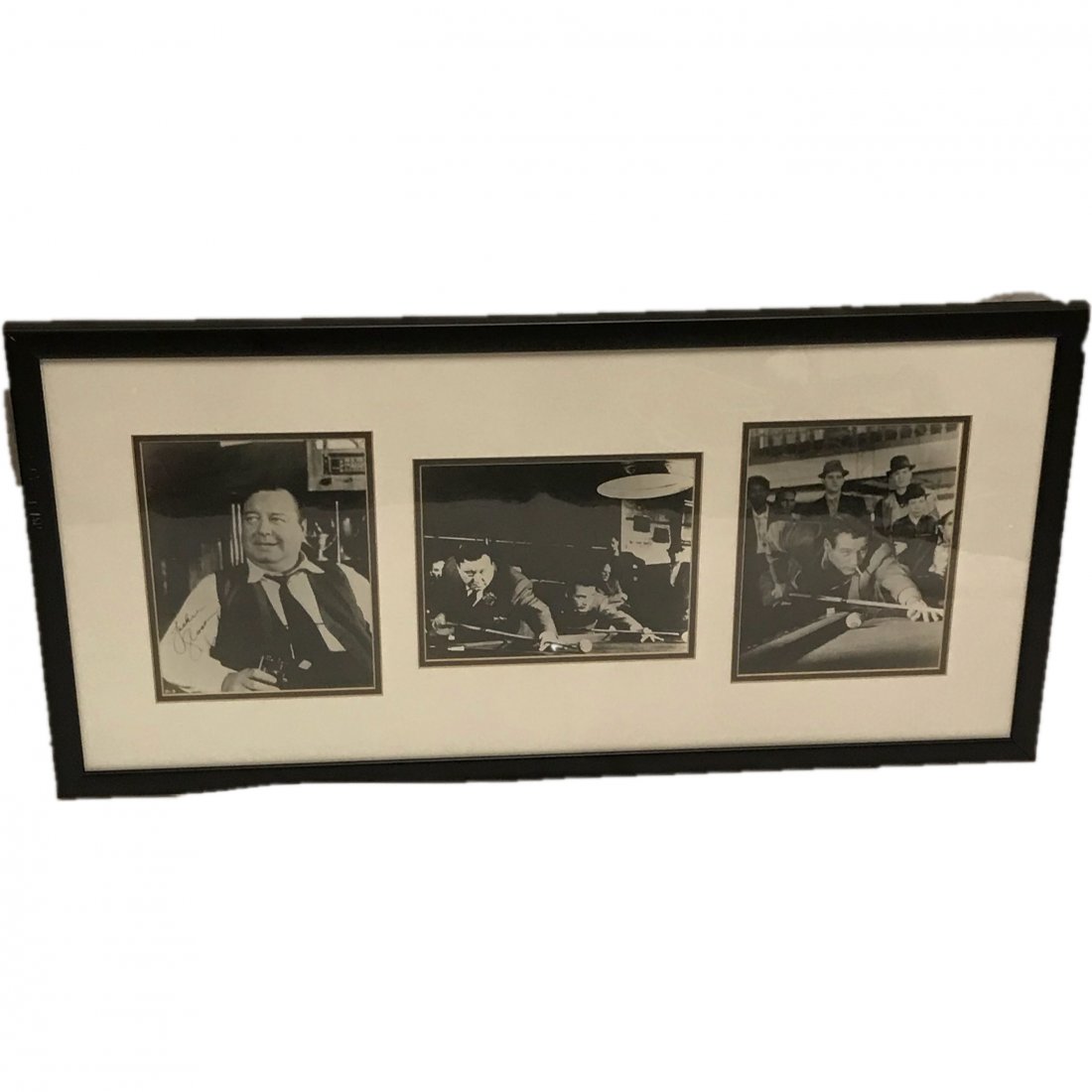 3 Framed Signed Stills from "The Hustler": This frame holds 3 8 by 10 pictures from the movie "The Hustler." The consignor states that the signatures of Jackie Gleason and Paul Newman are genuine.. The Newman signature is quite fad