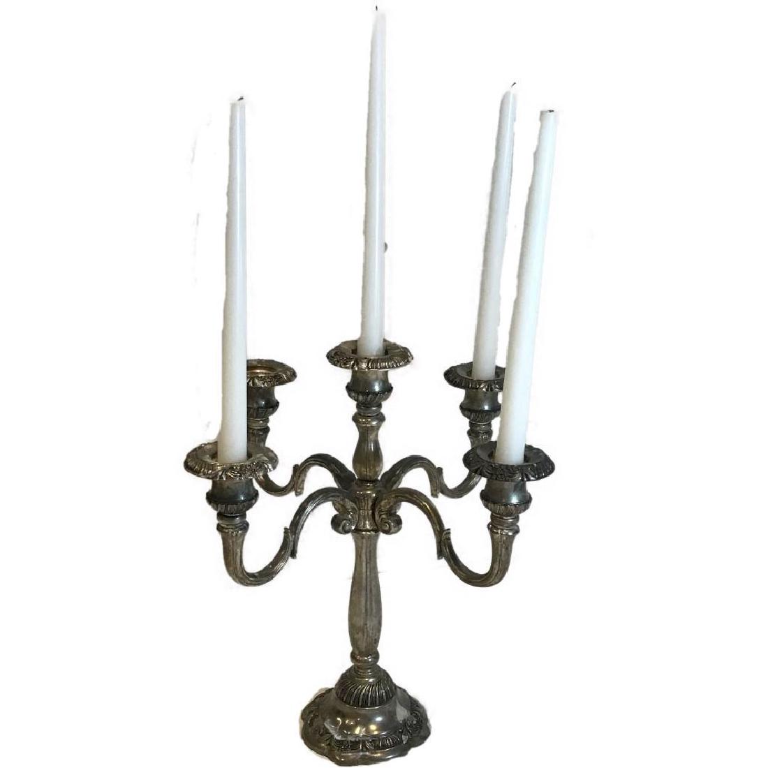Godinger Silver Candelabra: This silverplate Candelabra was made by The Godinger Silver Art Company. It measures approximately 11.5" tall and 10.5" across. It holds 5 candles.