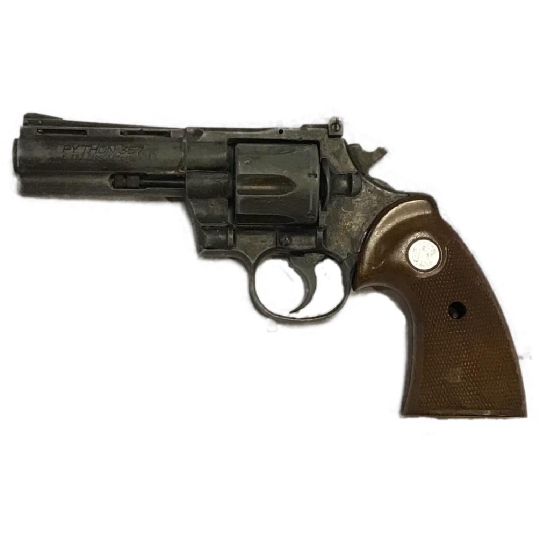 .357 Revolver Replica Prop Gun: Replica Colt Python .357 revolver made by MGC Model Gun Company in Japan. It appears to have the tip of the hammer broken off.