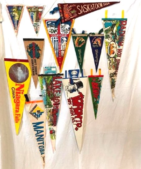 12 Vintage Souvenir International Travel Pennants: This is a fun lot of vintage souvenir pennants from international travel destinations.Â Included are: Pierrefonds Castle in France, Compiegne France, Niagara Falls Canada, Swift Current Saskatchewa