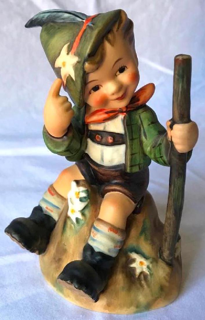 Vintage German Hummel Figurine: This classic figurine based on the sketch of Sister Maria Innocentia Hummel was produced by Goebel.Â It is Titled " The Mountaineer" It was produced Circa 1978 TMK-5. It measures approximately 5"