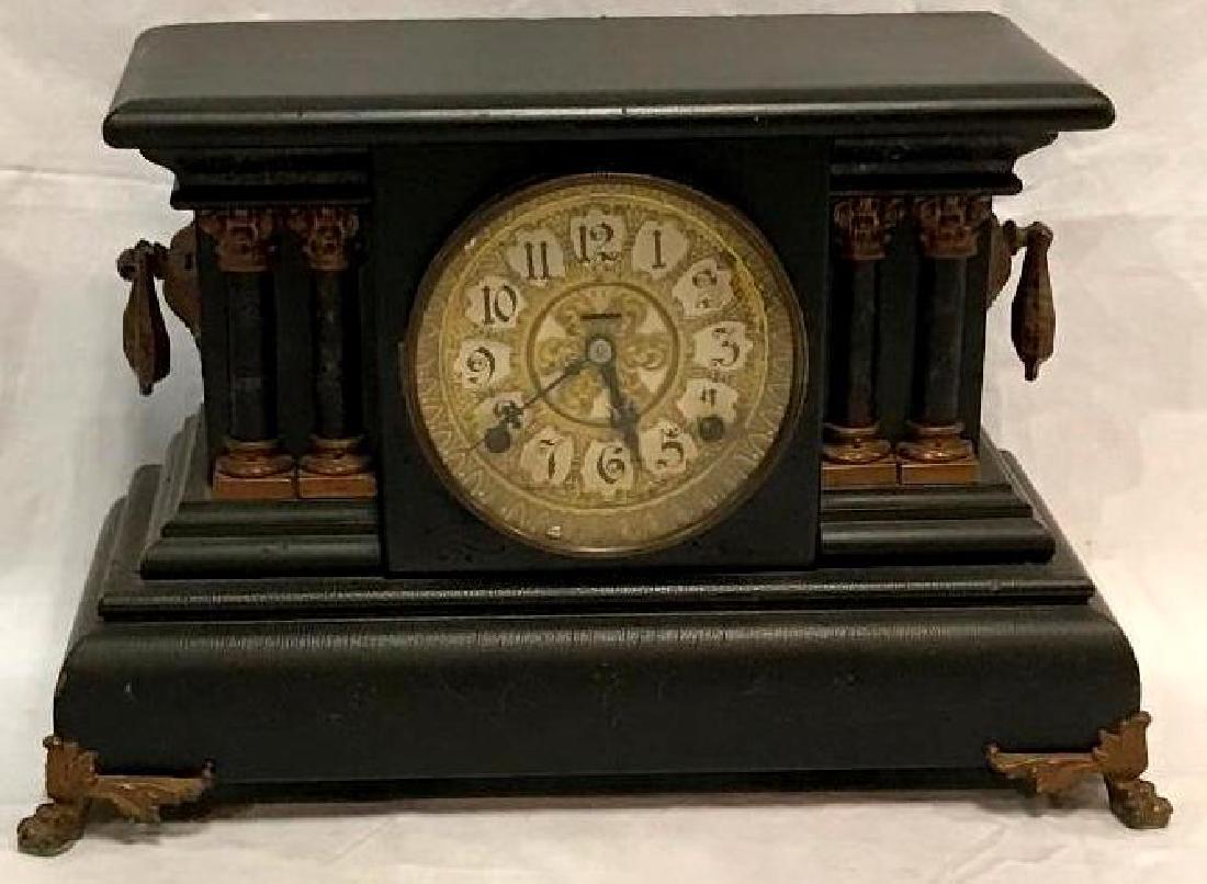 E. Ingraham 8 Day Mantle Clock: Adrian 8 Day mantle clock made by the Ingraham Clock Company. It measures approximately 10.75" tall by 16" across and 12" deep. The tag on the back reads: "eight day, half hour strike, cathedral str