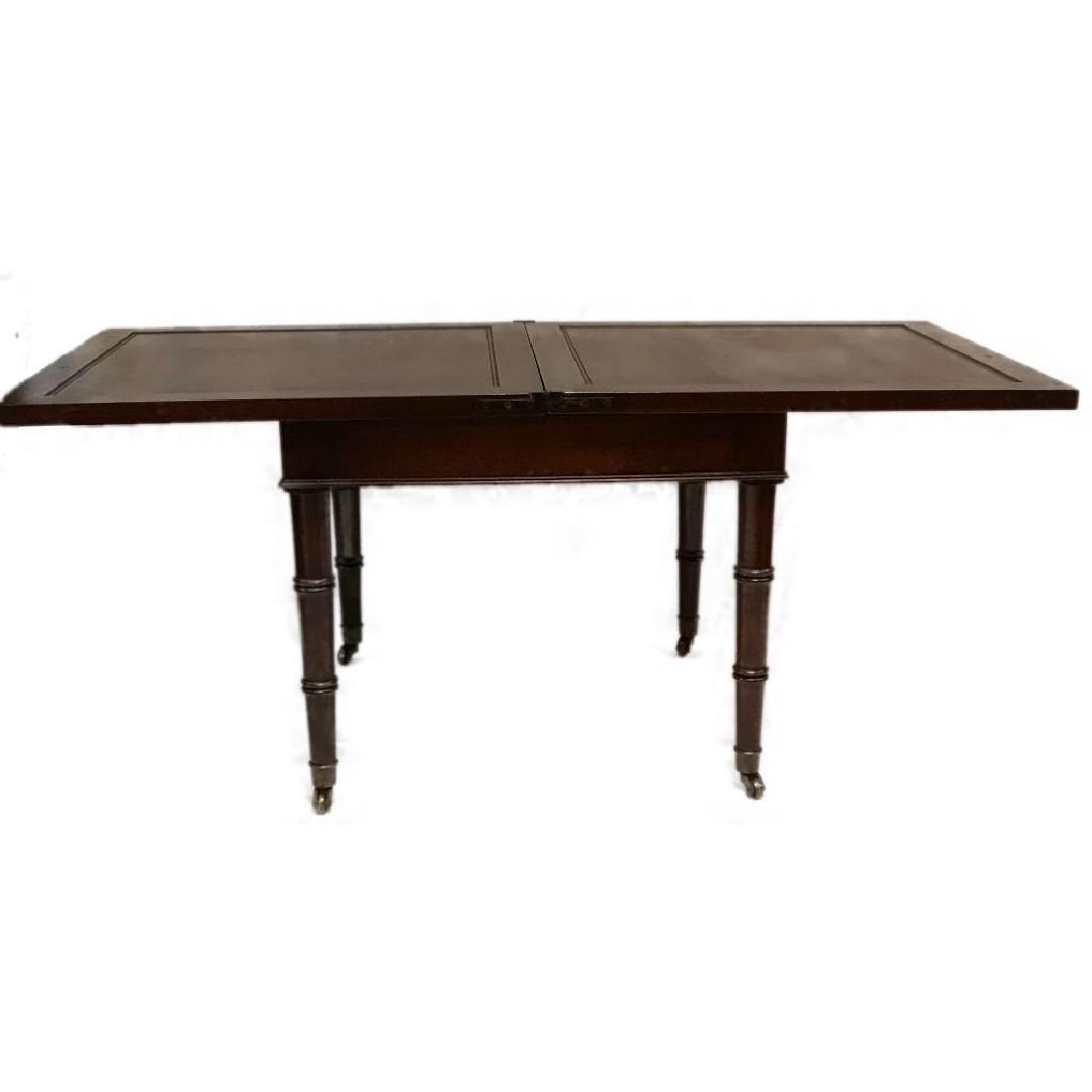 Convertible End Table: This table folds and converts from small to large. It is sitting on brass casters. It's a fun old piece.