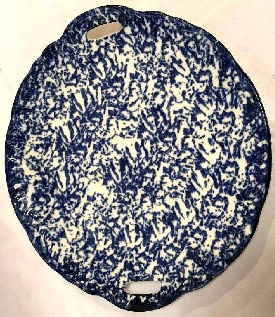 Blue Sponge splatter paint serving dish: Vintage blue sponge paint transfer ware platter. This is unsigned. it has embossed scroll work along the rim. It measures approxinatly 11" across. there is some crazing but i did not detect an