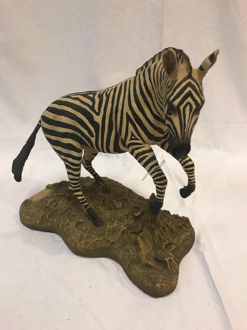 Creart Zebra Statue: Handcrafted Sculpture of a Zebra. Numbered 195 of 5000. Approx. 12" height by 12" length. Very good used condition. Only damage I have seen is a very tiny chip on the left ear that can easily be