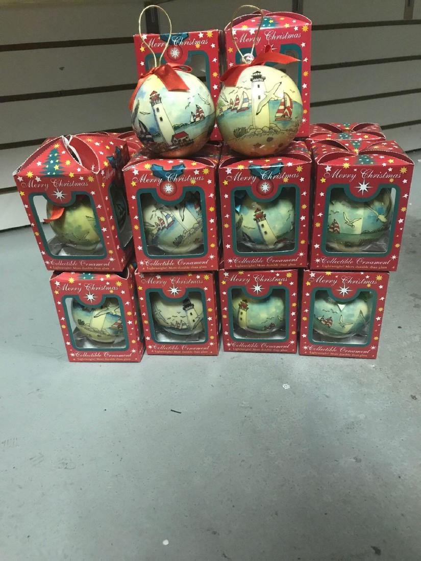 18 Lighthouse Theme Christmas Ball Ornaments: 18 3ï¾” christmas ball ornaments in a beach and lighthouse theme. 9 have a black top lighthouse and 9 have a red top lighthouse. Made by Agiftcorp.
