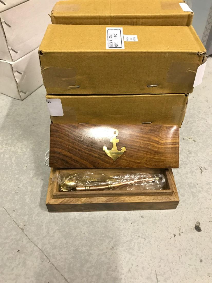 7 Brass Boatswain Call Whistle in Wood Case: 7 boatswains whistles. They come in ornate wooden cases with a gold inlay anchor.