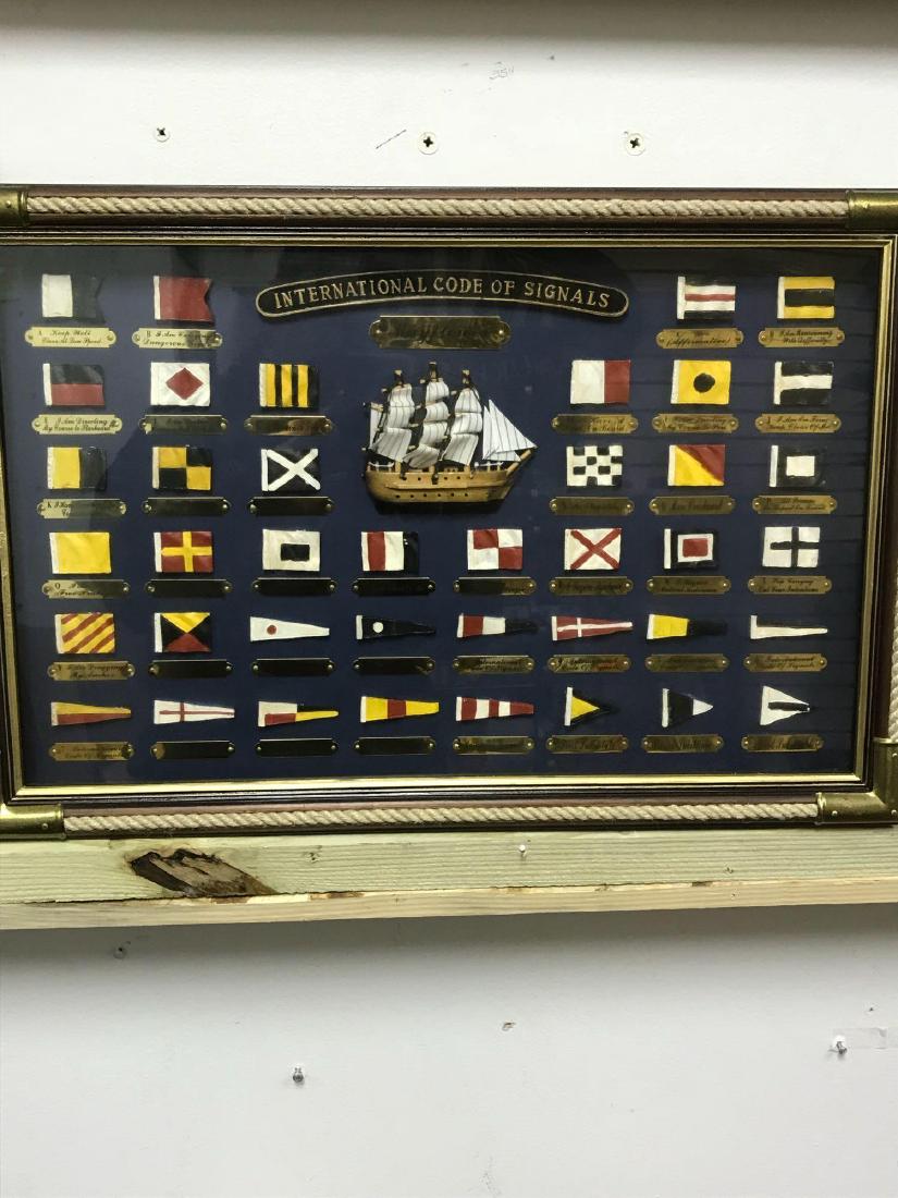 Nautical Sailing Flag Display Shadow Box: This is a cool piece of art .Â It's a shadowbox of a sailing ship, nautical flags, and what they mean.