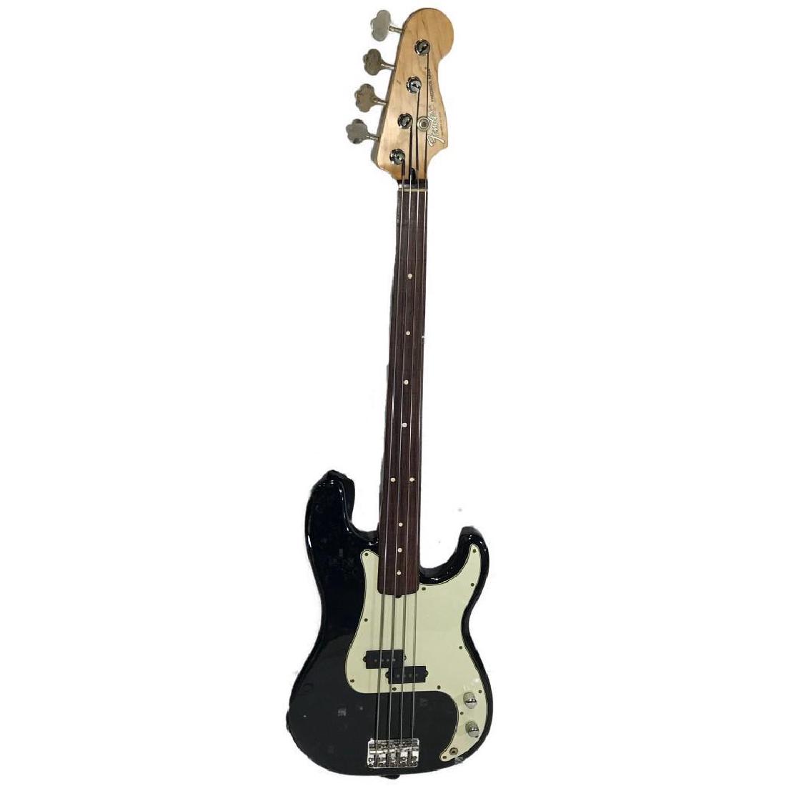 Fender Precision Bass With Hard Case: This is a fretless Fender Precision Bass.Â American Made circa 1992.Â Comes with Ed Hardy strap, hard case, patch cable and some strings.Â I just ripped through the intro to "Sweet Emotion" a