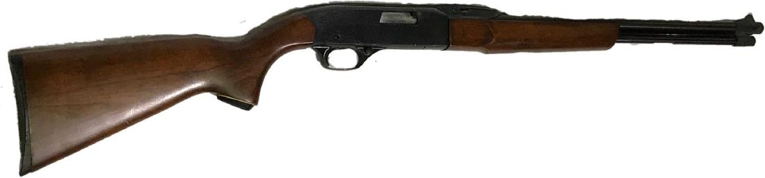 Winchester 290 .22 Caliber Rifle: Up for auction is a Winchester model 290, .22 caliber (long or long rifle) with a 21.5" barrel. The metal finish shows handling marks, edge wear, and scattered surface spotting. The bluing is around 7