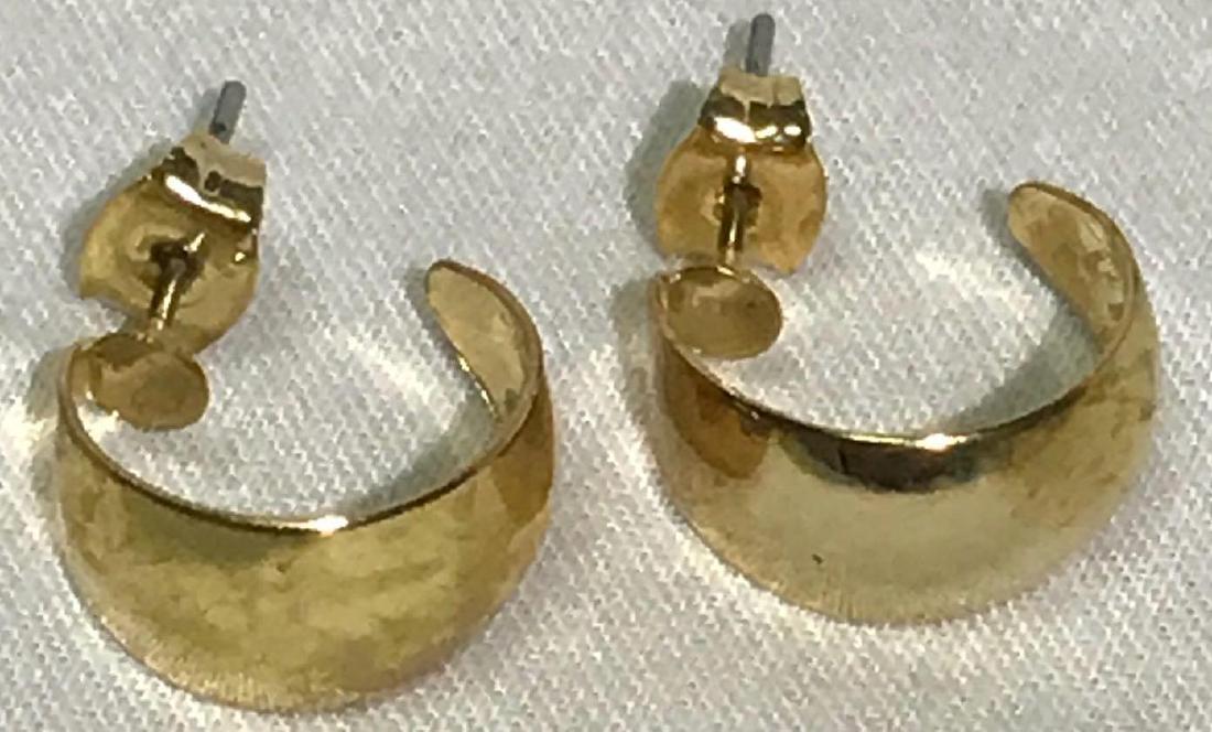 Gold Earrings: One nice pair of gold colored earrings. They have a total weight of 1.64 grams. I was unable to find a signature on these but they are possibly genuine gold