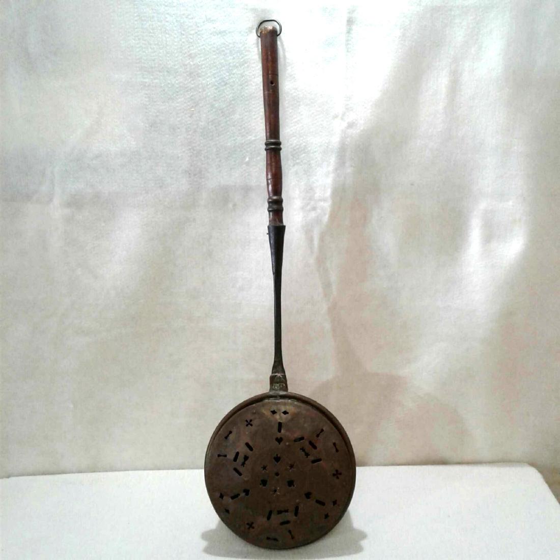 Antique Brass Bed Warmer: Antique Brass Bed WarmerÂ that was manufactured in Curley, PAÂ inÂ 17th century, Pierced copper with a iron and wooden handle. Rustic home decor piece.Â Measures approximatelyÂ 38.5" x 11.5