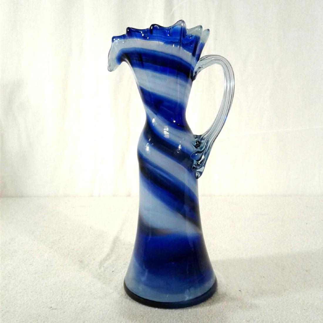 Swirled Colored Glass Vase Pitcher: Swirled Colored Glass Vase Pitcher, vintage hand blown and sculpturedÂ blue and whiteÂ glass colored swirl vase or pitcher, measures approximately 9.5" x 3.5" and is in very good used condition.Â