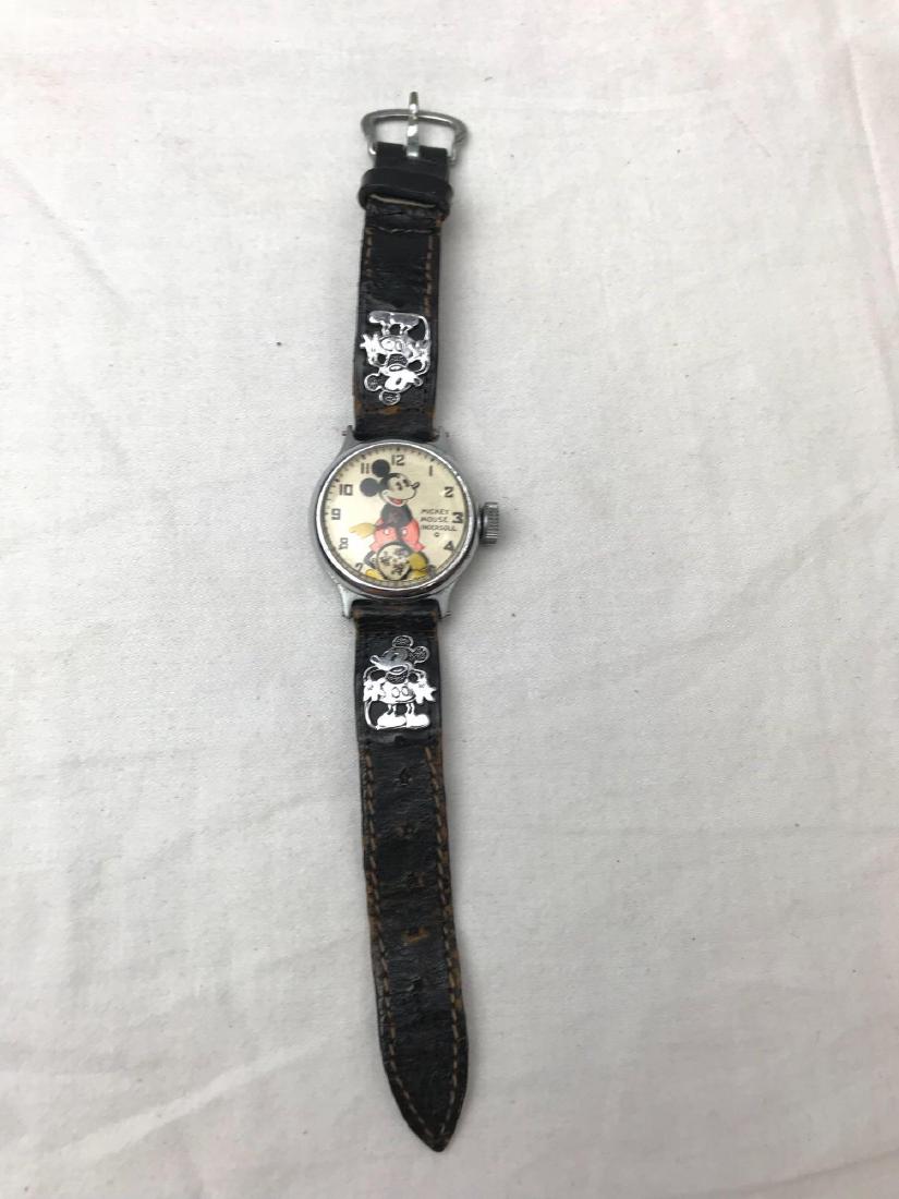First Release Mickey Mouse Watch by Ingersoll, 1933: First Release Mickey Mouse Watch by Ingersoll, 1933; this is a very fine example of the first Micky Mouse watch issued. The face shows a smiling Mickey on the front, his arms being the minute and hour