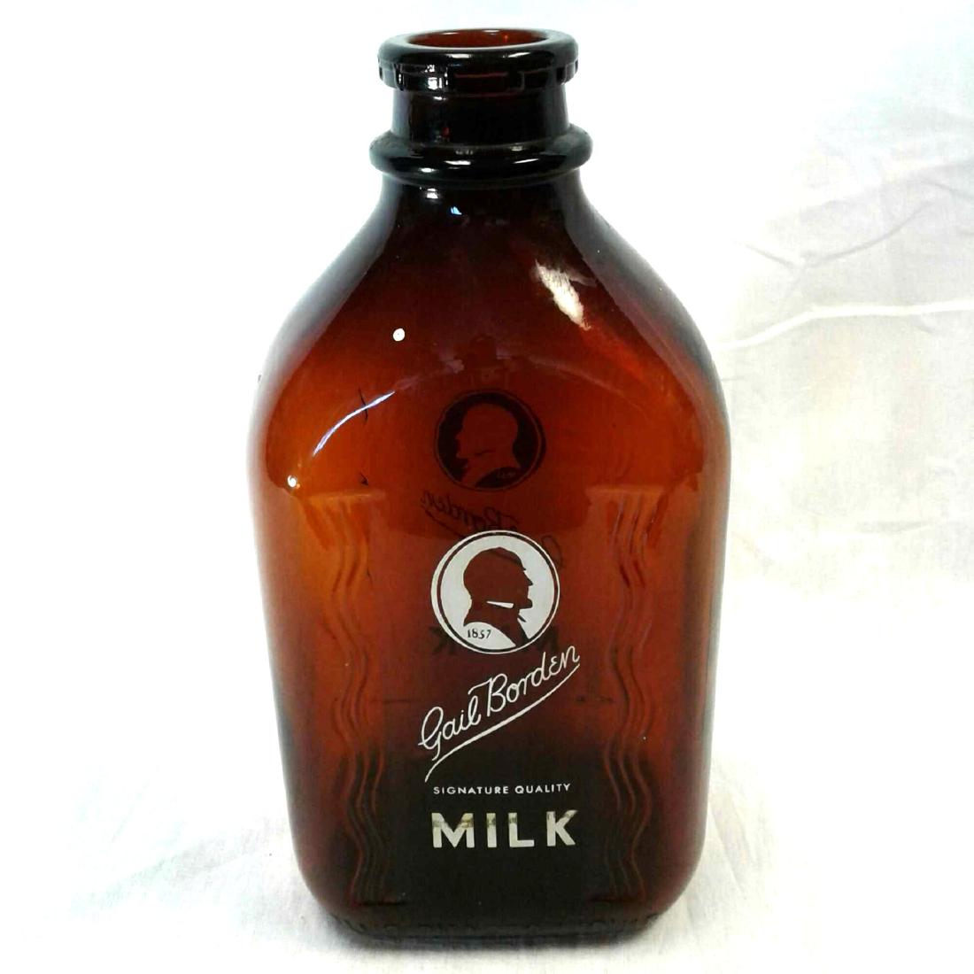 Gail Borden Milk Bottle: Gail Borden Milk Bottle, brown glass, one gallon size, excellent condition, measures 5" W x 4" D x 10" H.