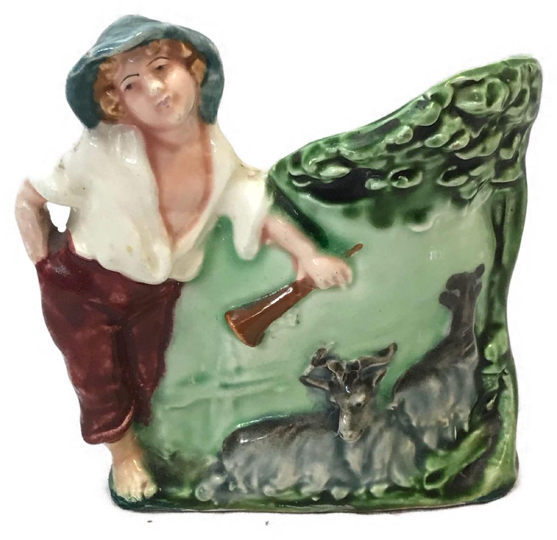 Small Art Pottery Planter, A Boy Herding Goats: Small Art Pottery Planter, A Boy Herding Goats; this is a pretty little planter showing a young boy with horn and watching his goats. It is marked "HK" on the reverse. The planter/vase is in very good