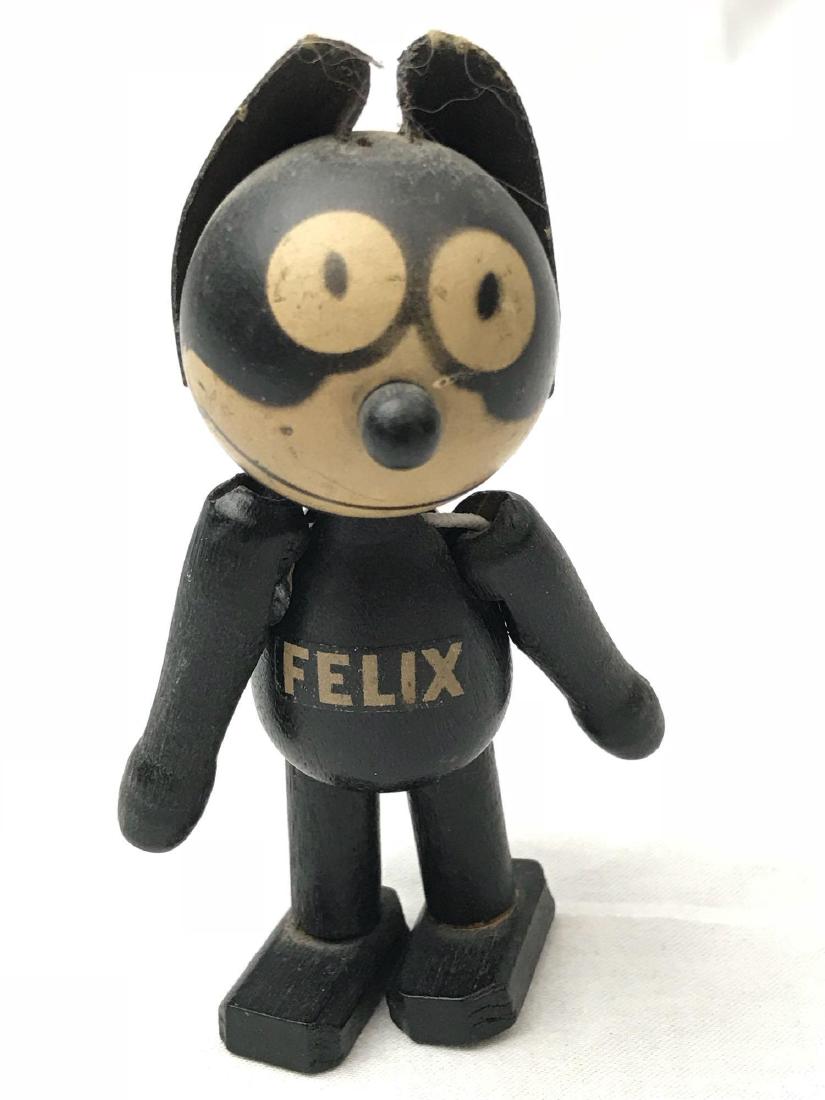 Vintage Felix the Cat Schoenhut Articulating Wooden Dol: Vintage Felix the Cat Schoenhut Articulating Wooden Doll; a rare 1920's Felix the Cat character wooden doll. This doll is complete including leather ear tabs. The doll is marked on the bottom of the l