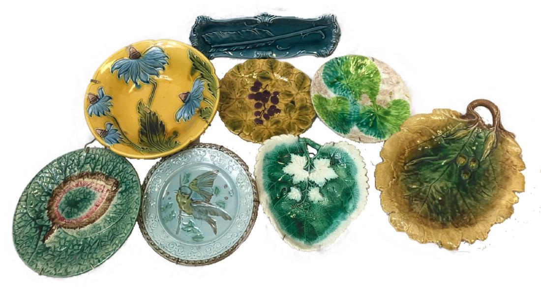 Lot of 8 Majolica Art Pottery Decorative Plates: Lot of 8 Majolica Art Pottery Decorative Plates; a complete collection of earthenware display plates, all with hangers attached. One piece of the 8 is marked "Sarreguemines France". All pieces are in 