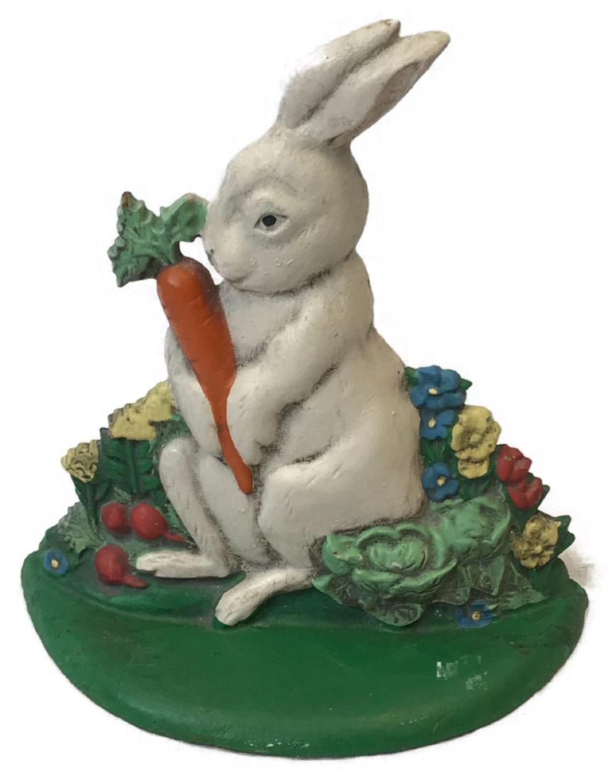 Vintage Bunny Cast Iron Door Stop: Vintage Bunny Cast Iron Door Stop; a very cute cast iron door stop of a rabbit cuddling a carrot in the garden. This piece is in very good condition with strong colors and solid finish. It measures 7 