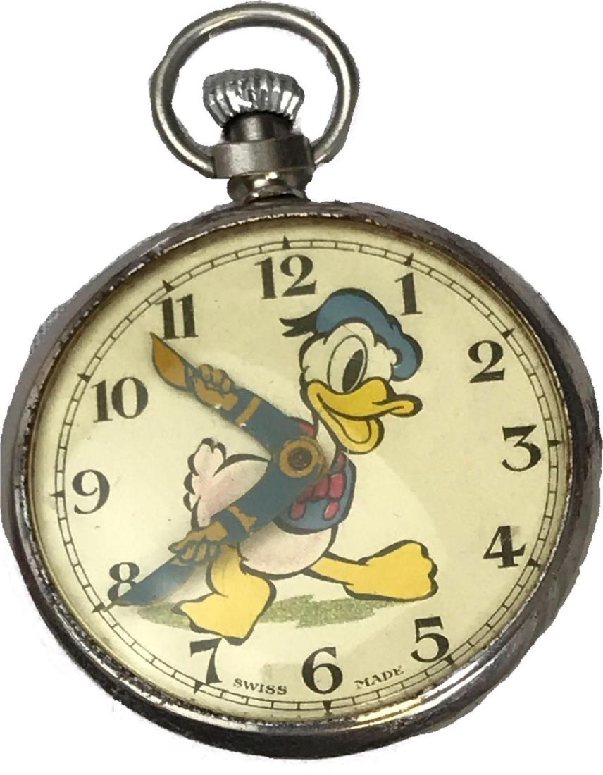 Vintage Donald Duck Working Pocket Watch: Vintage Donald Duck Working Pocket Watch; a very fine piece showing Donald telling time with moving arms and semaphore flags, reminding us of his sailor background. The face is marked Swiss Made. The