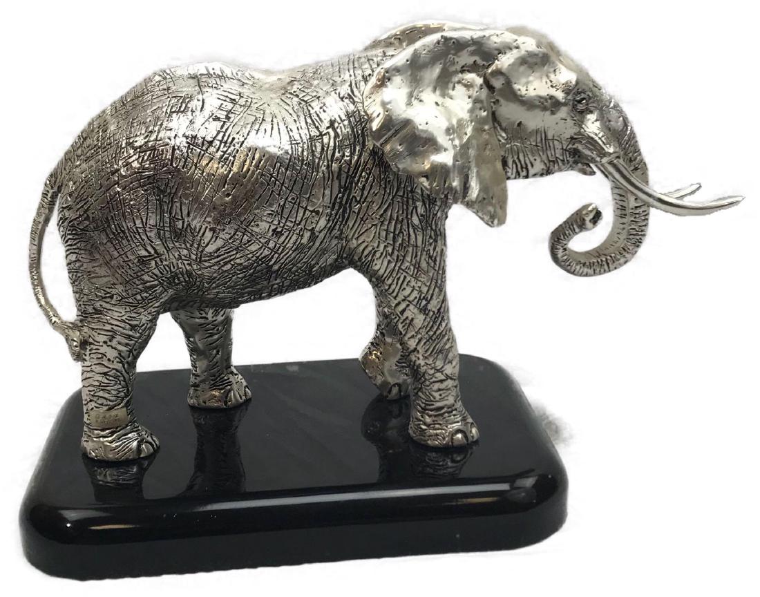 African Bull Elephant Sculpture, Sterling Silver: African Bull Elephant Sculpture, Sterling Silver; this large and heavy piece is very well crafted. The attachedÂ Â mark reads "LUCA R. ARG. 925". Stunning in appearance, the body shows a textured 