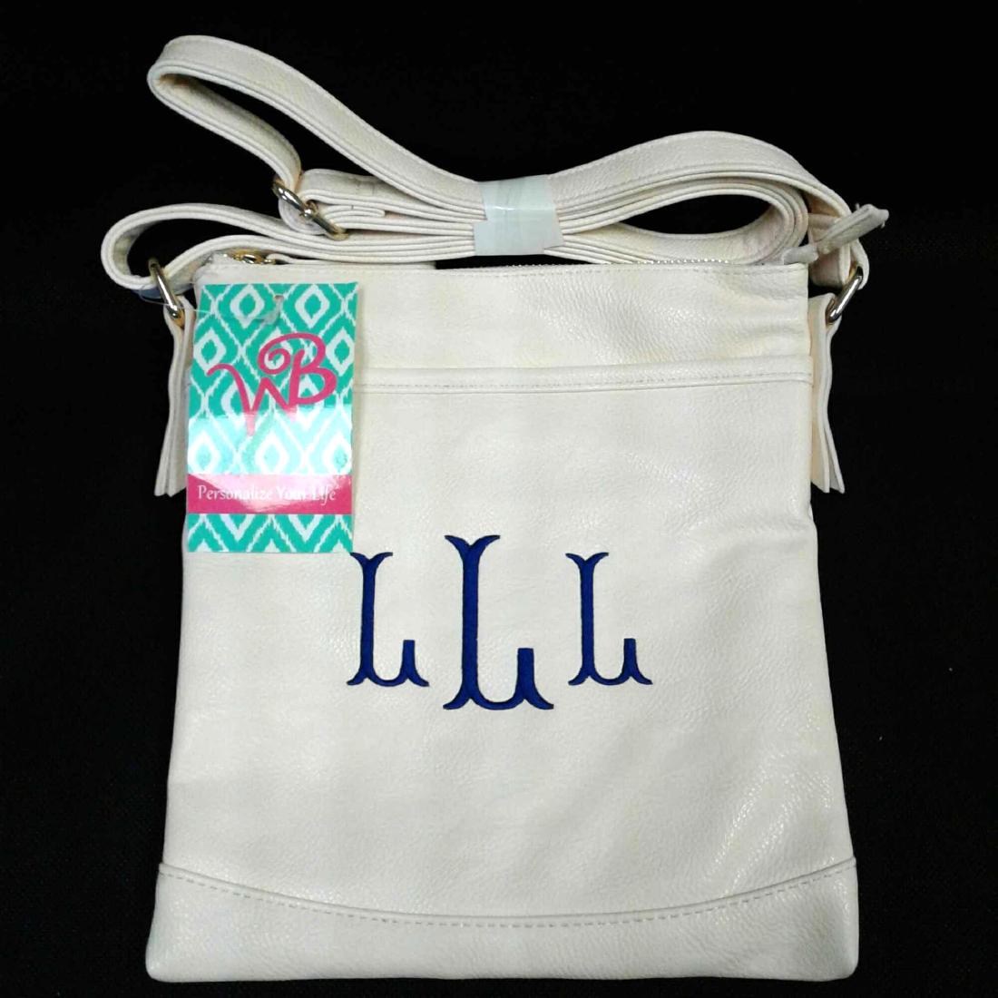 WB Creme Purse, Monogrammed "LLL": WB Creme Purse, Monogrammed "LLL" in navy blue, a very nice over the should purse in like new condition. The purse measures 9" W x 10" H with an adjustable shoulder strap.Â