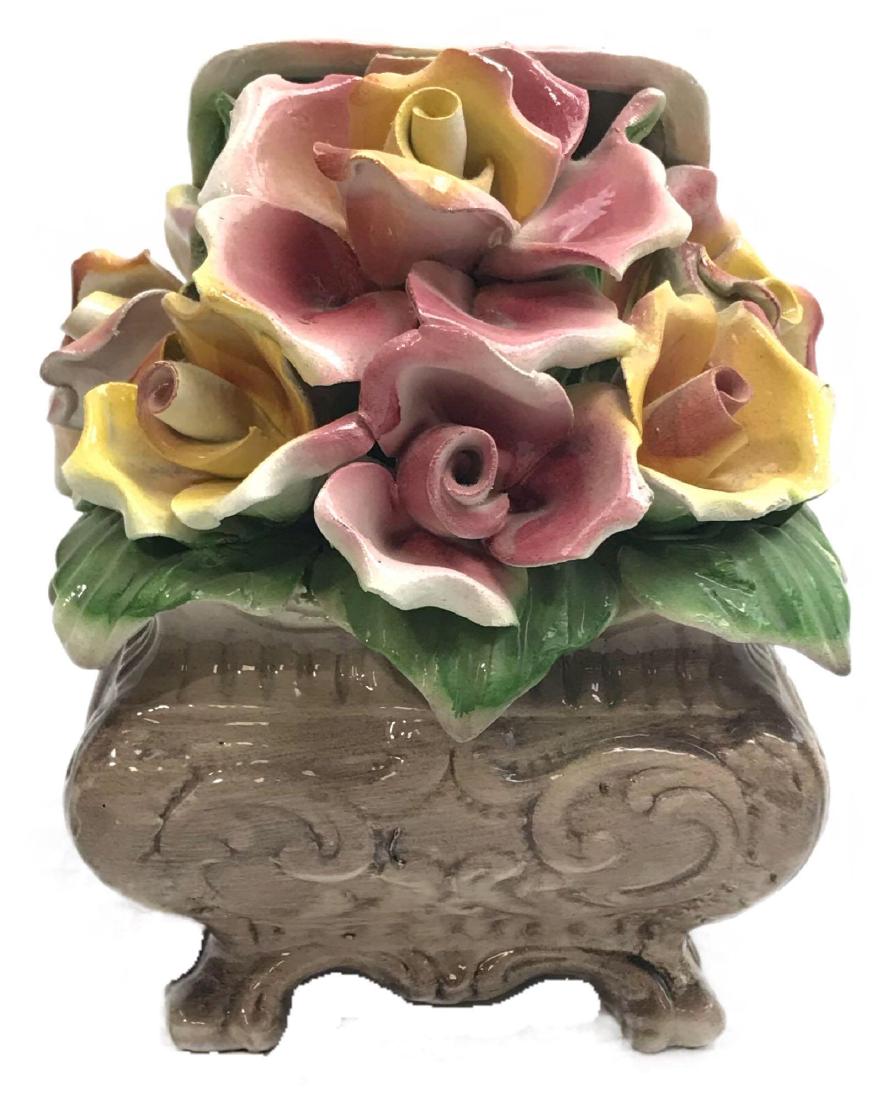 Vintage Capodimonte Porcelain Box of Roses, Marked: Vintage Capodimonte Porcelain Box of Roses, Marked; this sculpture shows a box of six overflowing pink and yellow roses. It is marked. This piece is in very good condition showing only one edge of a p