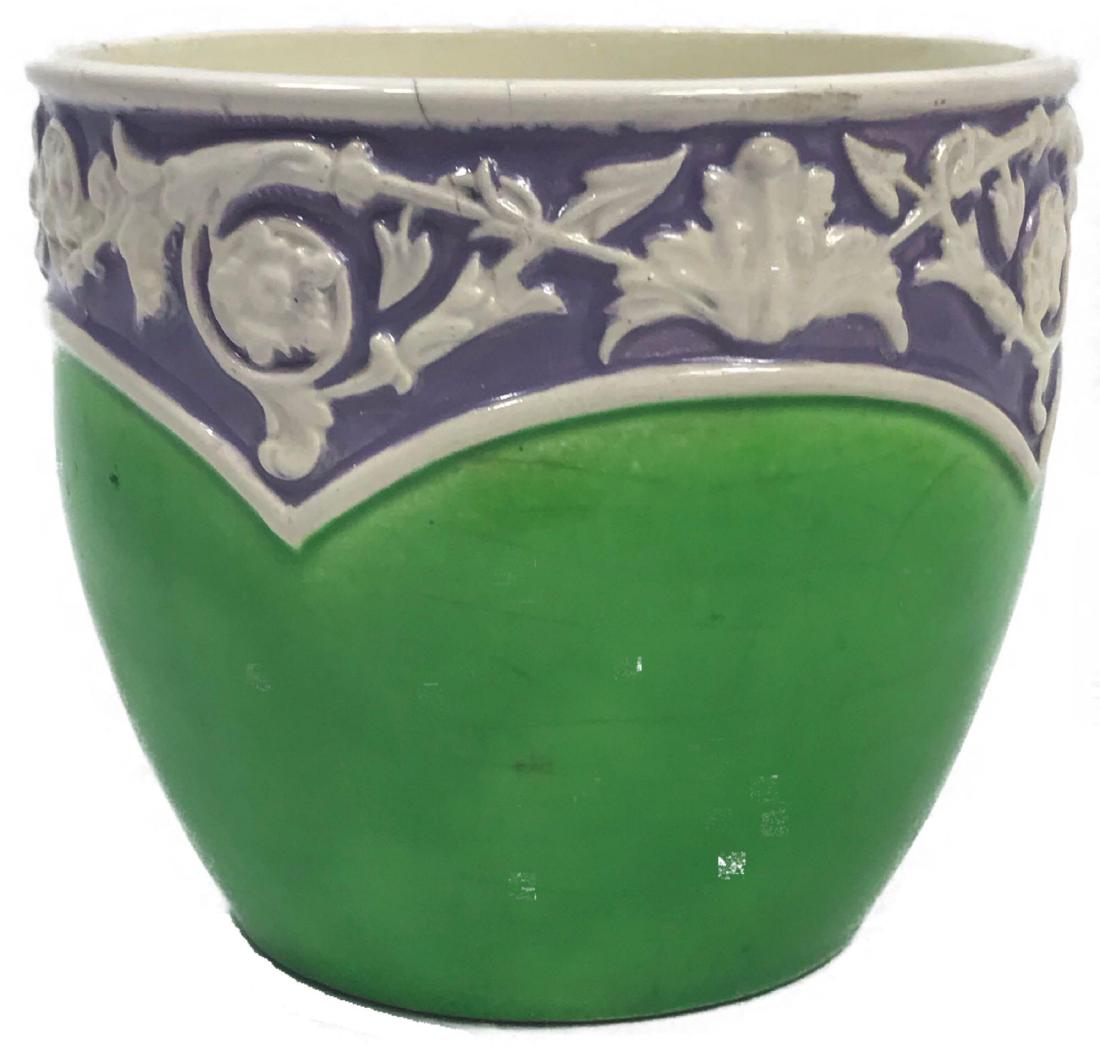 Glazed Pottery Bowl: Glazed Pottery Bowl, Majolin earthenware from Czechoslovakia, green with purple and white, marked 7043/9, smallÂ chip on bottom edge,Â measures 4 1/2" H x 5" DIA.