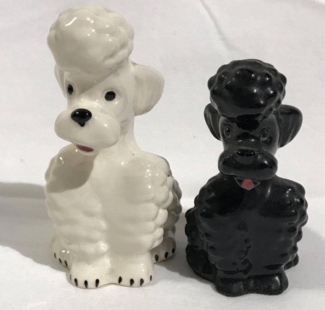 2 Goebel Poodle Ceramic Dog Figurines: 2 Goebel W. Germany ceramic poodles. One black, one white. They are signed number KT160 and KT161. They measure approximately 3â€ tall. They are in good shape with no chips or cracks detected. They