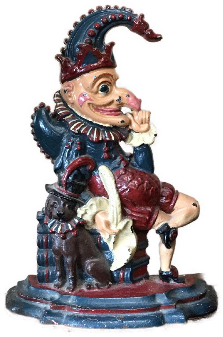 Antique Cast Iron Punch Doll Doorstop Britain: This antique Victorian Punch doll doorstop is believed to have been made in Great Britain, Circa late 1800's. It is a very heavy piece. It measures approximately 12" tall by 9" wide. It has s