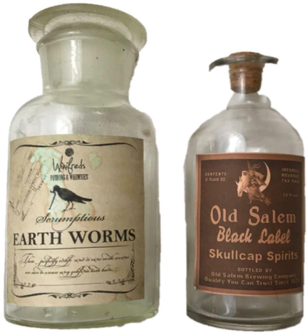 Two Halloween Apothecary Jars;: Two Halloween Apothecary Jars; Fantastically spooky Halloween apothecary jars. 1.) Scrumptious Earth Worms, made by Winifred's Potions & Whimsies. 2.) Old Salem Black Label Skullcap Spirits. The Ear