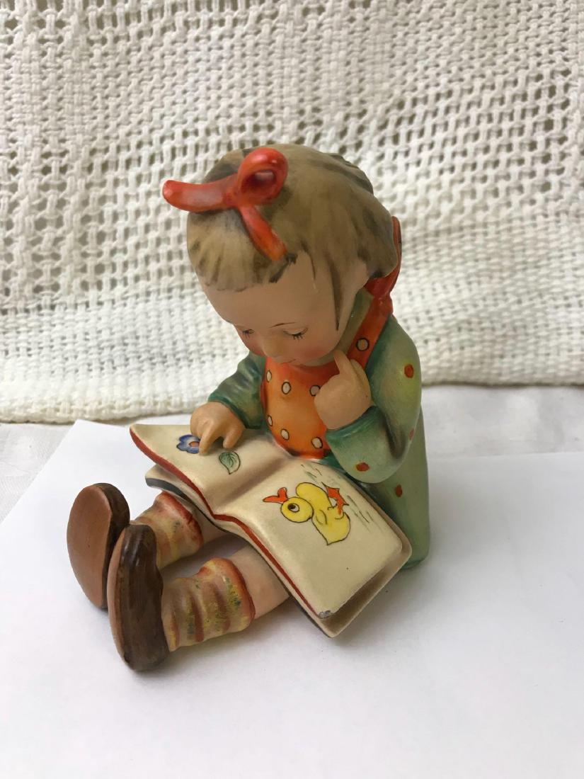 Hummel Goebel Bookworm Figurine TMK 2: Hummel Goebel Bookworm Figurine TMK 2; Made in Germany, one minimal chip on corner of book. Measures at approximately 4" L x 3 1/2" W x 4" H.