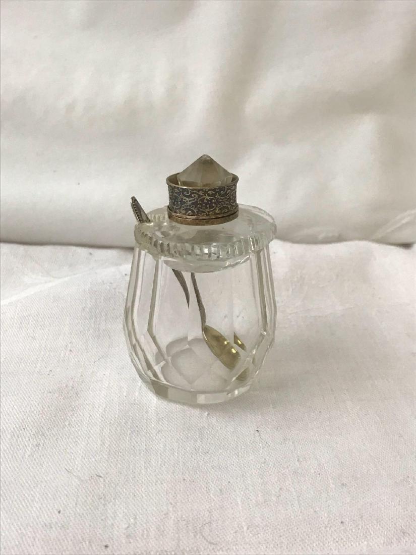Vintage Glass Salt Cellar: Vintage Glass Salt Cellar; A classic piece that comes with a silver spoon and a silver ring on the topper. It measures at approximately 2" H x 3" W.