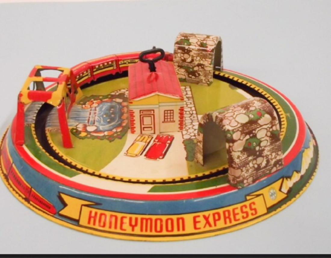 Vintage Marx Honeymoon Express Tin Toy: Description: Mar Honeymoon Express Tin Toy,Vintage Color: Please See Photos Dimensions: Height: Width: 9" x 9" Depth: Condition: FAIR - Used. Moderate wear consistent with age Damage and/or Points of 