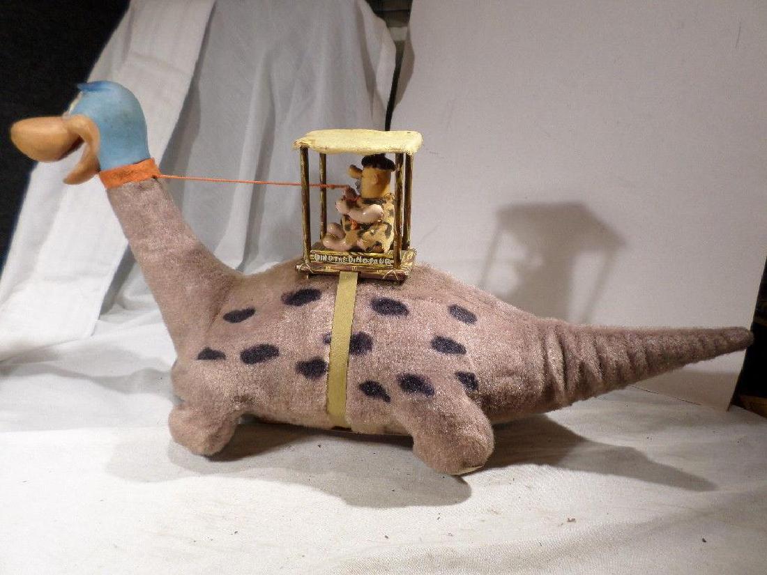 Vintage 1962 Marx Flintstones Dino Toy: Vintage Marx 1962'Dino the Dinosaur' w/ Fred Flintstone (Working) no tears, or apparent damage other than normal wear from age. Working order.This Item Will Ship From Utah.