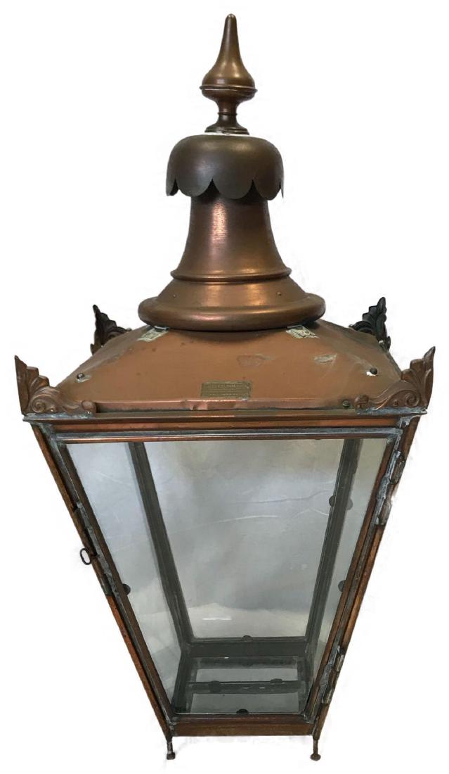 Antique London Streetlight W. Parkinson & Co.: A large, circa 1900 antique copper W. Parkinson Co. English street lamp. This light fixture comes from the streets of London, England.It features an ornate chimney with finial on the hinged lid above 