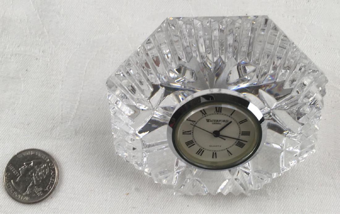 Waterford Crystal Gem Shaped Desk Clock: Waterford Crystal Gem Shaped Desk Clock; this crystal gem is in excellent condition, it is crisp and bright, very appealing. The piece measures 3" W x 2 1/2" D x 2 1/2" H.