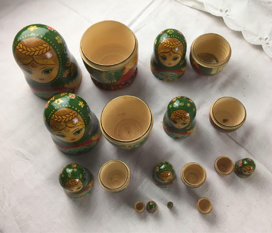 Vintage Russian Matryoshka Nesting Dolls, Signed by: Vintage Russian Matryoshka Nesting Dolls, Signed by Artist; a set of 10 dolls although it is noted that the second smallest doll's top half is missing. The bottom of the largest doll shows the artist'