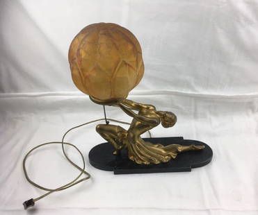 Vintage Art Deco Figural Frankart Style Lamp: Vintage Art Deco Figural Lamp in the Frankart Style; a stunning piece showing a dancer holding an amber crackled glass globe. The dancer is mounted on a steel base with a black marble finish. All is i